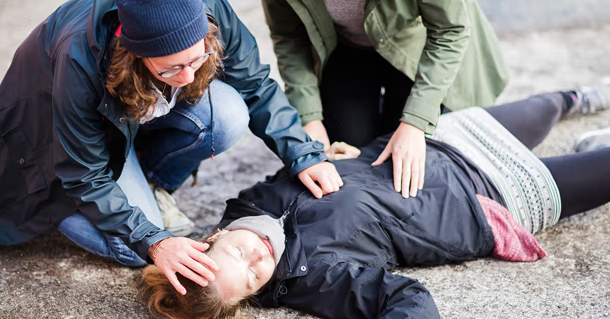 Person having seizure with help